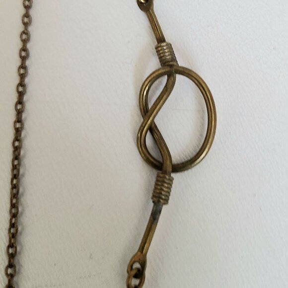 Brass long chain with knot details. - Picture 3 of 5